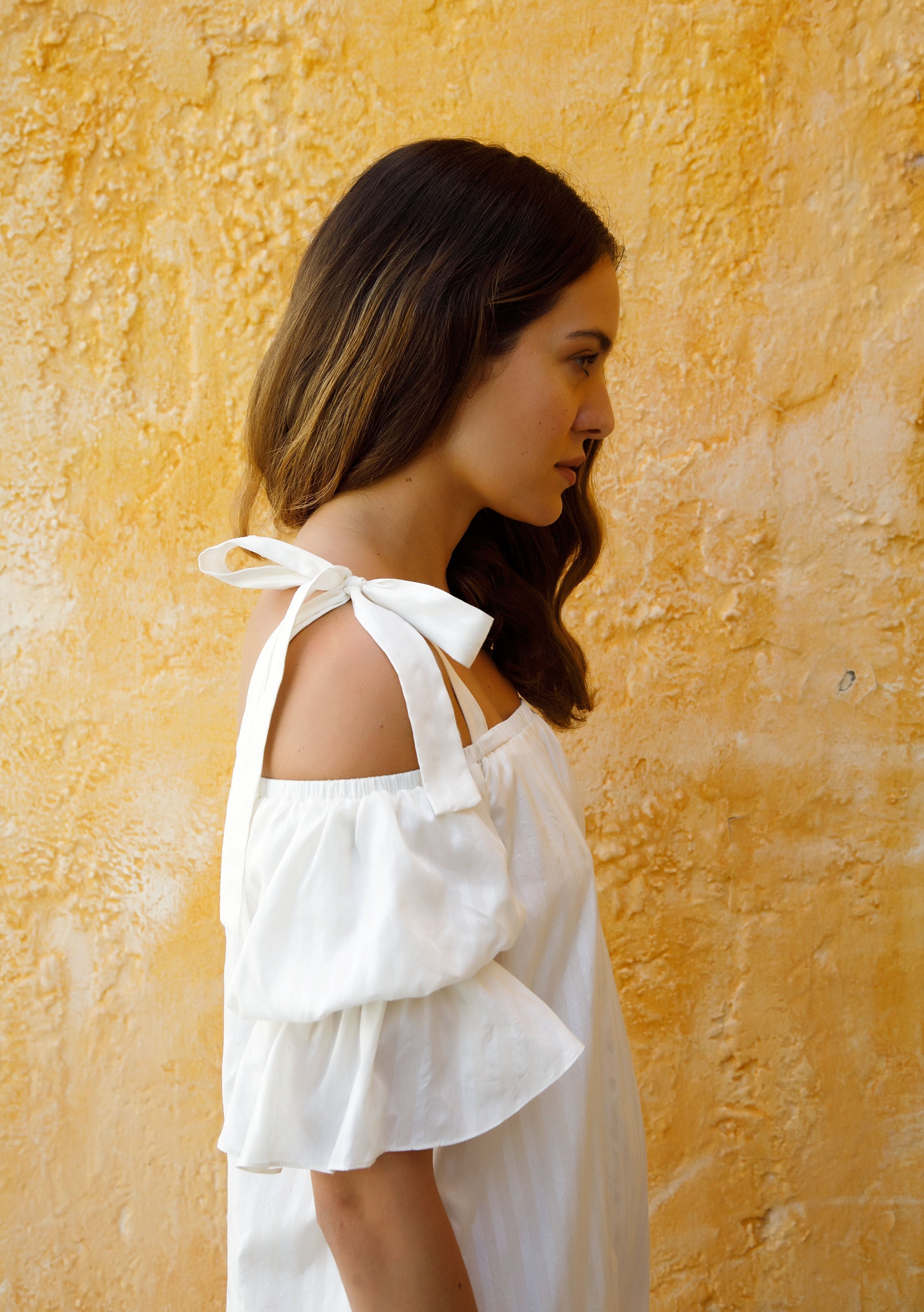 side view of white stripe cotton silk off the shoulder puff sleeve dress